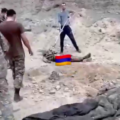 Armenian soldiers kill and then pour petrol and burn the bodies of Azeri soldiers.